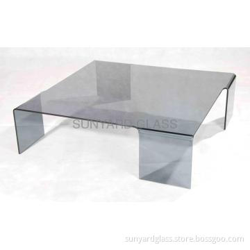 Curved glass coffee table